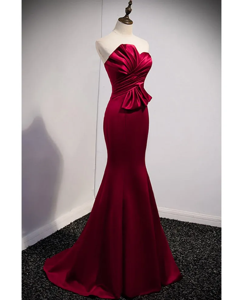 A noble and minimalist wine red sleeveless off shoulder ball dress with wine red strapless backless straps and ground length fishtail evening dress