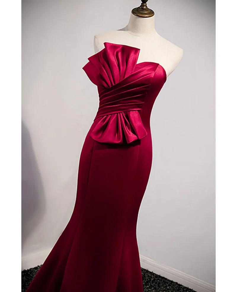 A noble and minimalist wine red sleeveless off shoulder ball dress with wine red strapless backless straps and ground length fishtail evening dress