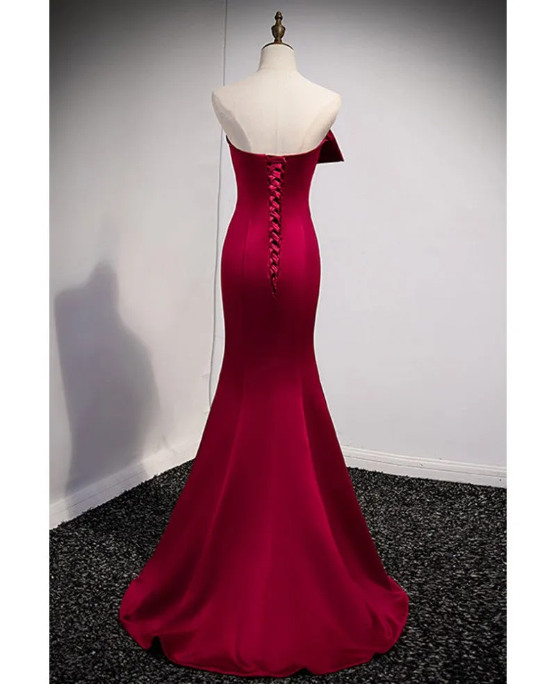 A noble and minimalist wine red sleeveless off shoulder ball dress with wine red strapless backless straps and ground length fishtail evening dress